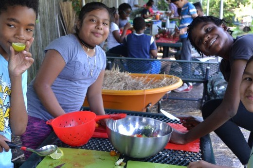 four children making salsa